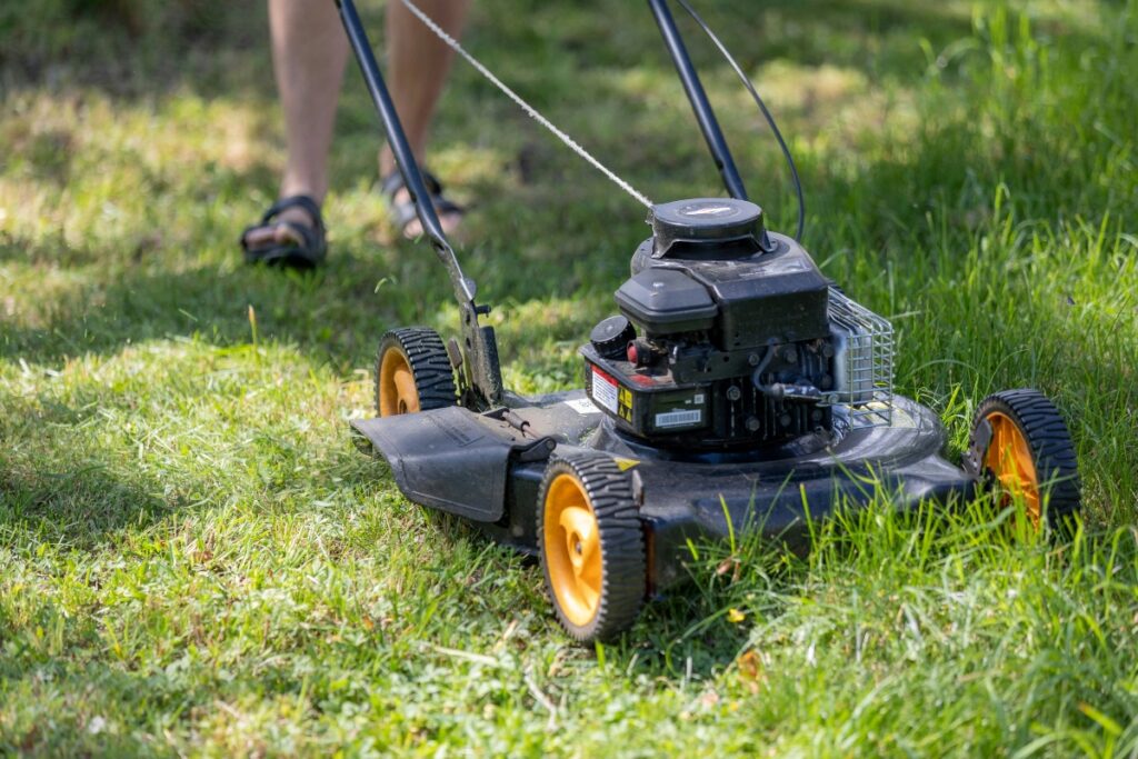 man mowing a lawn