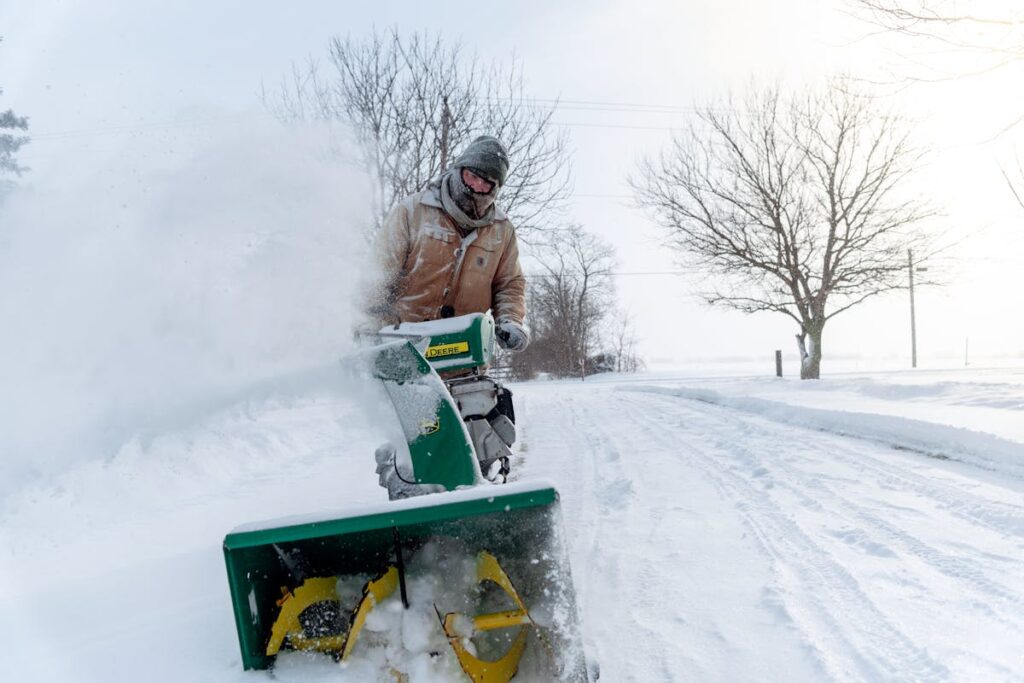 man removing snow