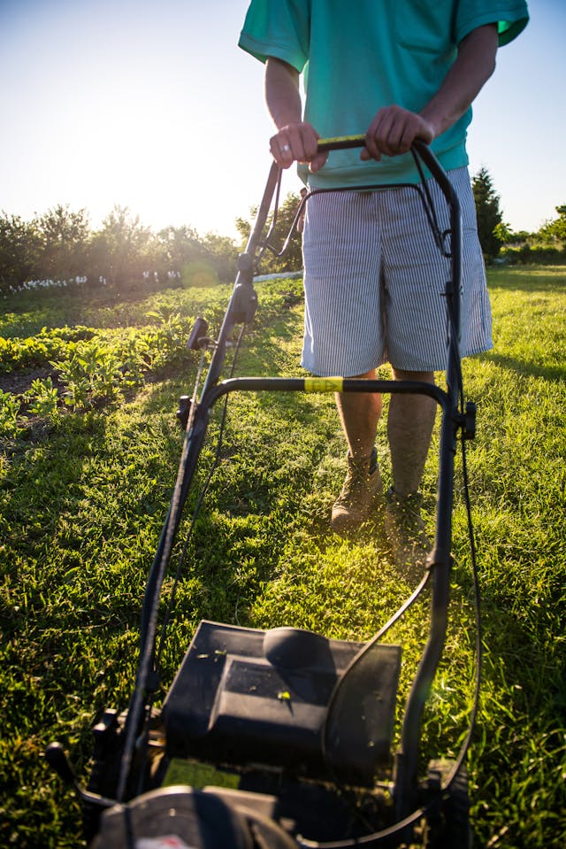 man mowing a lawn